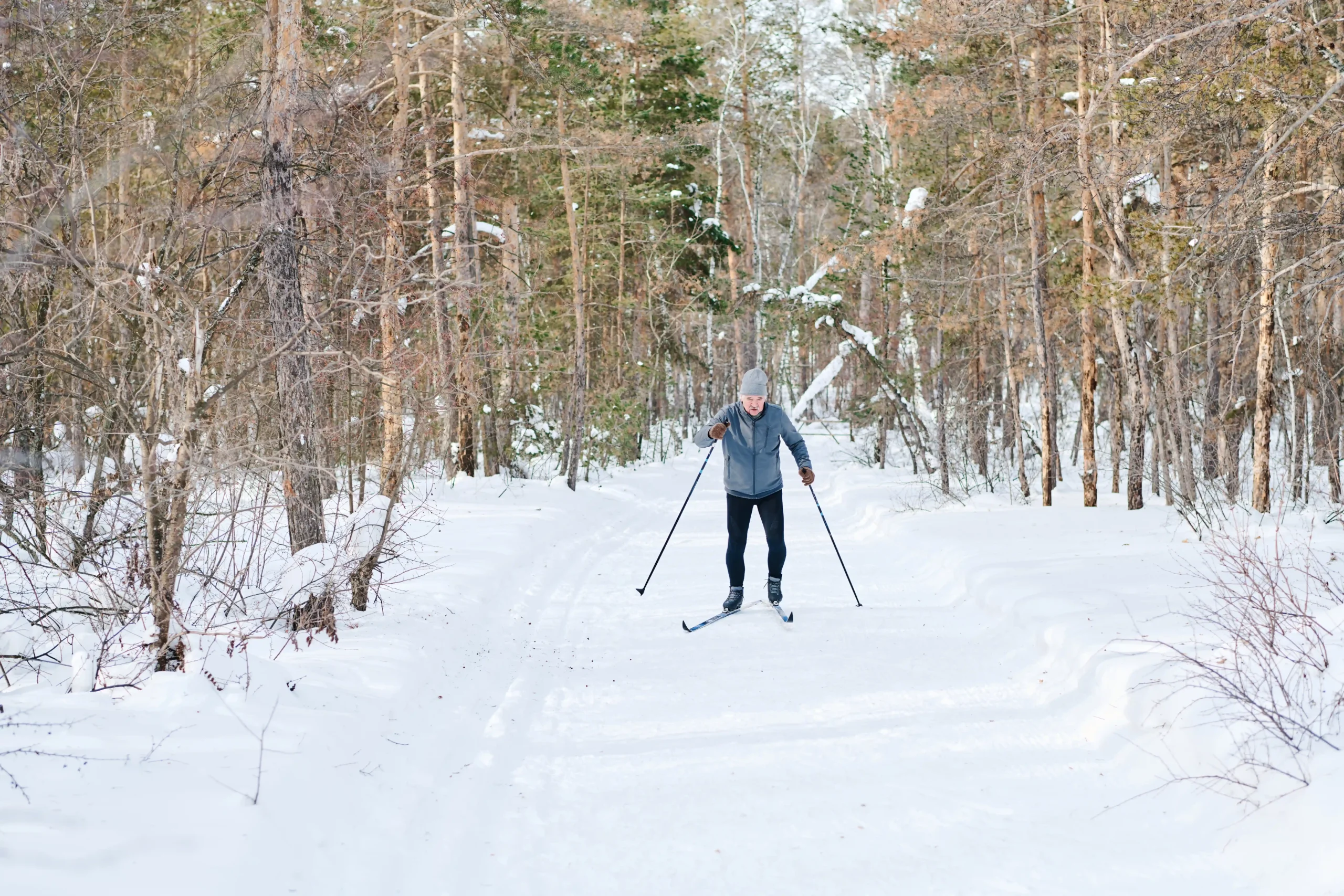 senior-caucasian-man-skiing-in-forest-2026-01-07-23-22-08-utc